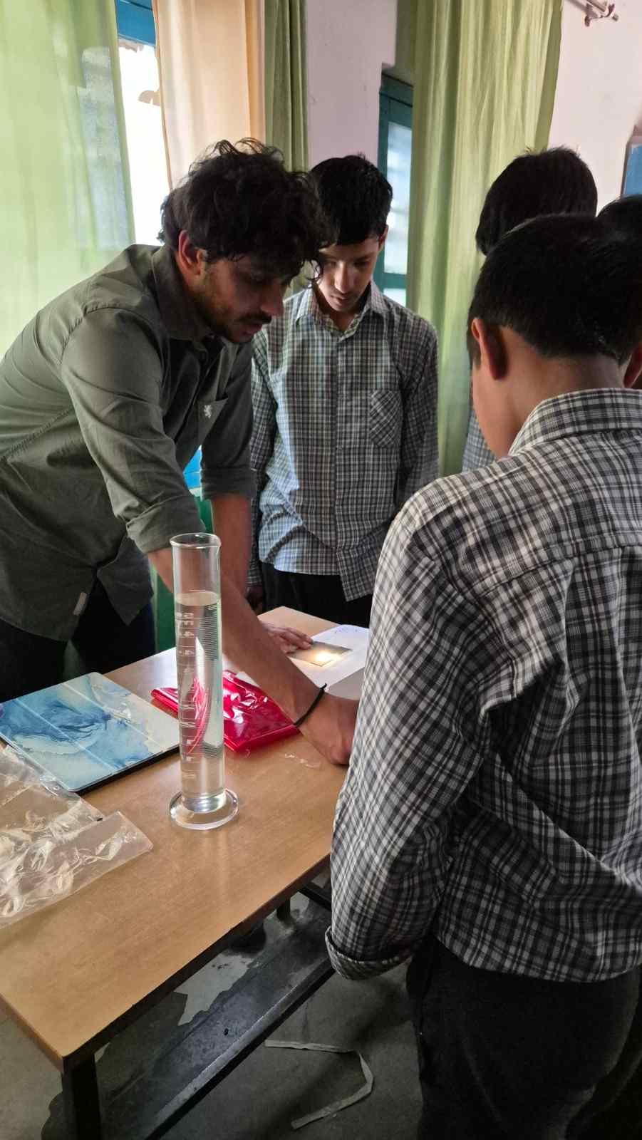 Apurav at Government School Batheri as part of OPTICA Student chapter's demonstration of optical experiments